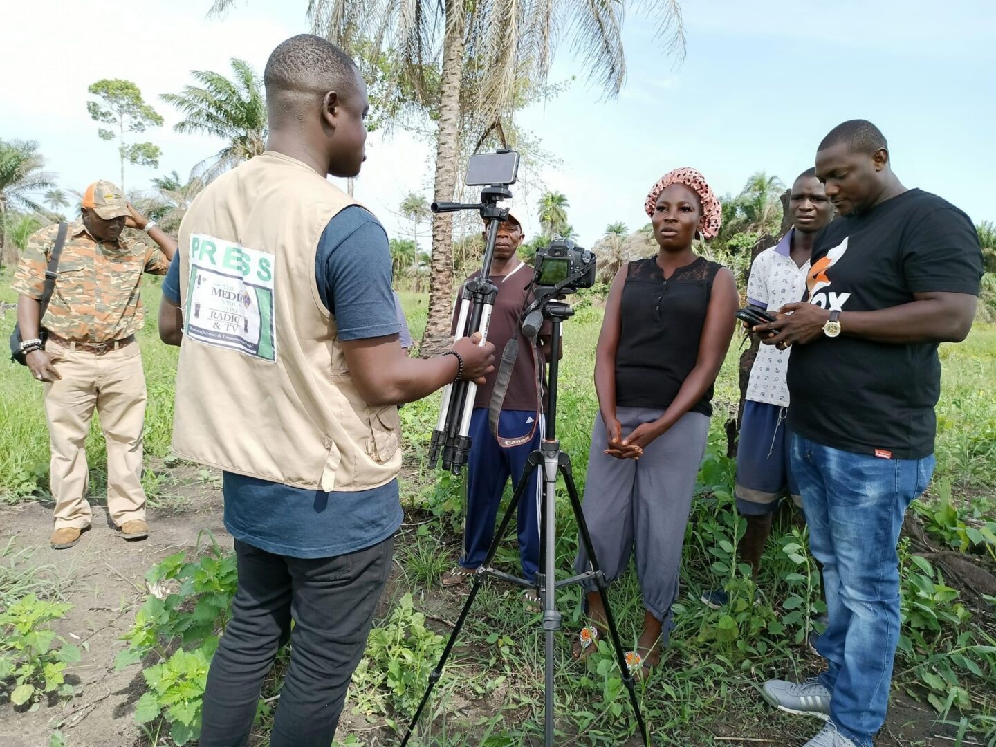 A group of people shooting with a camera and cameraman