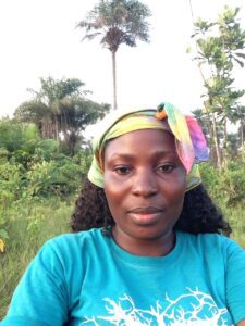 A woman with a colorful head scarf on.