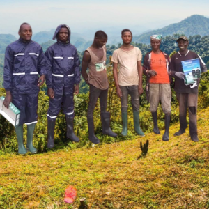 A group of men standing on top of a hill.